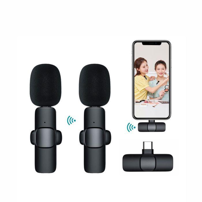 Two wireless lavalier mics with USB-C receiver, paired with a smartphone showing a vlogging/makeup tutorial scene